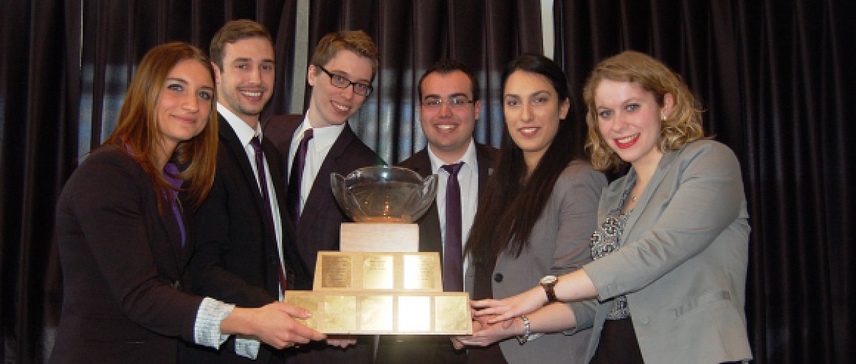 winning team holding the Michel Cloutier Trophee