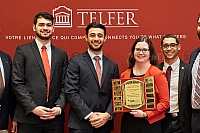 Winners of the CPA Accounting Case Competition holding their plaque