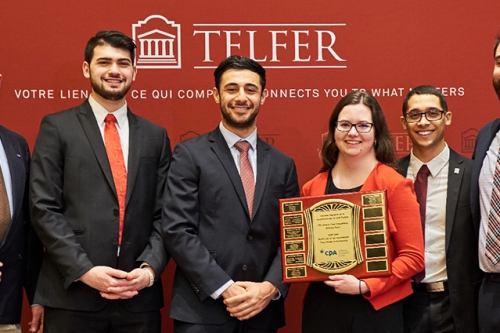 Winners of the CPA Accounting Case Competition holding their plaque