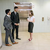 Students standing next to elevator